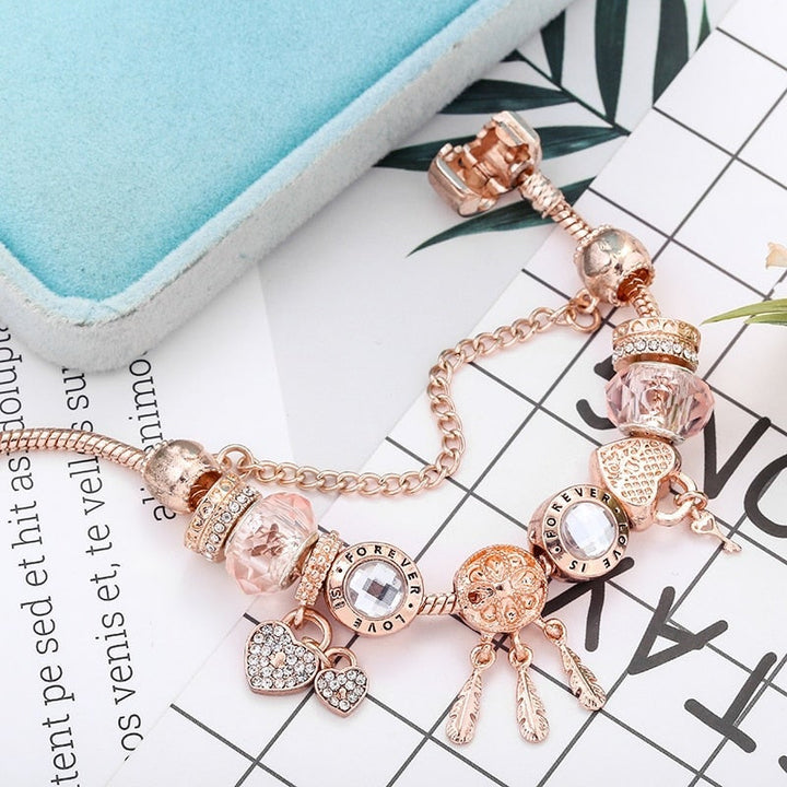 VEYLINIA | Elegant snörosarmband med silverhängen